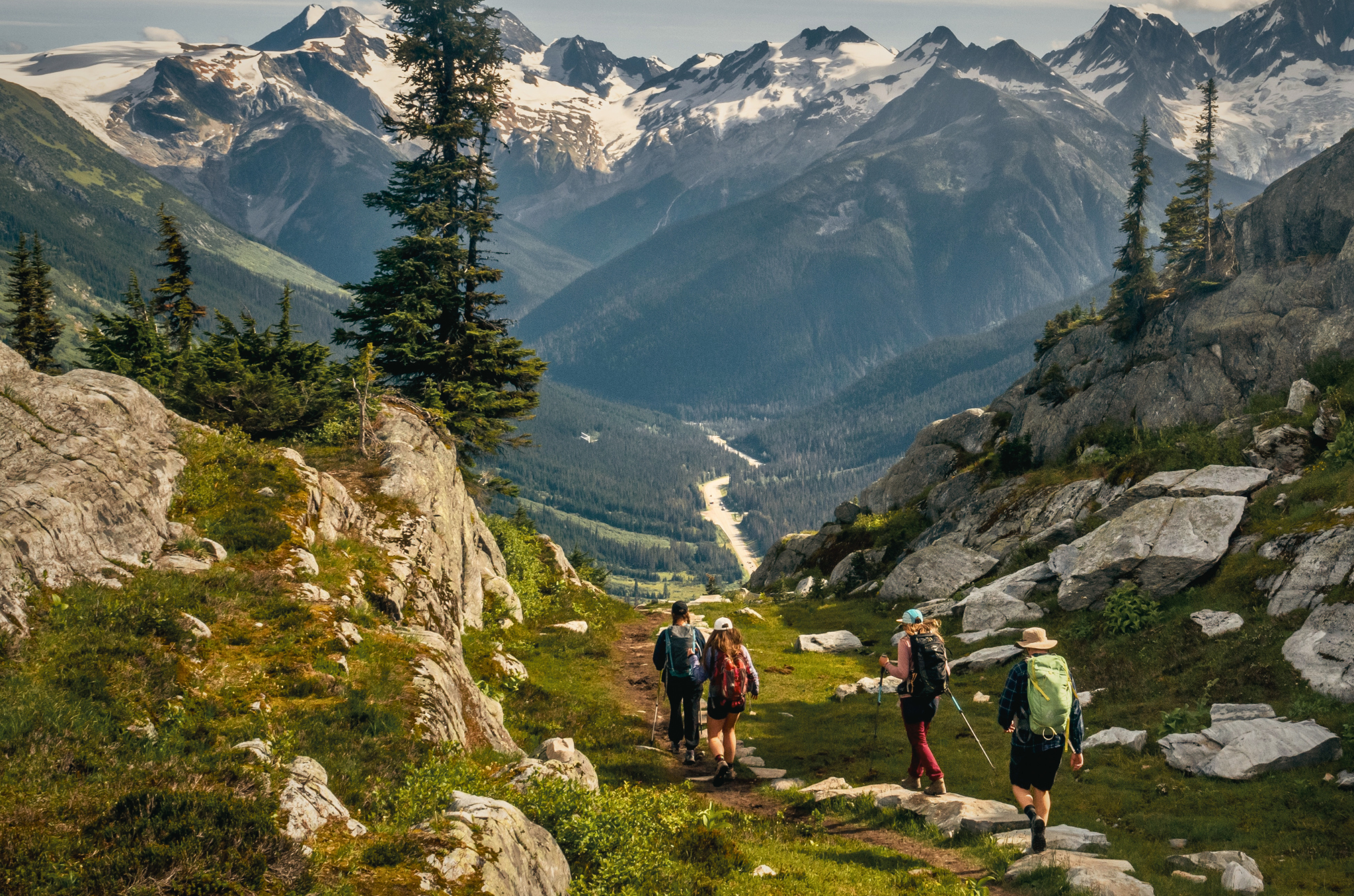 4 people hiking in revelstoke mountains