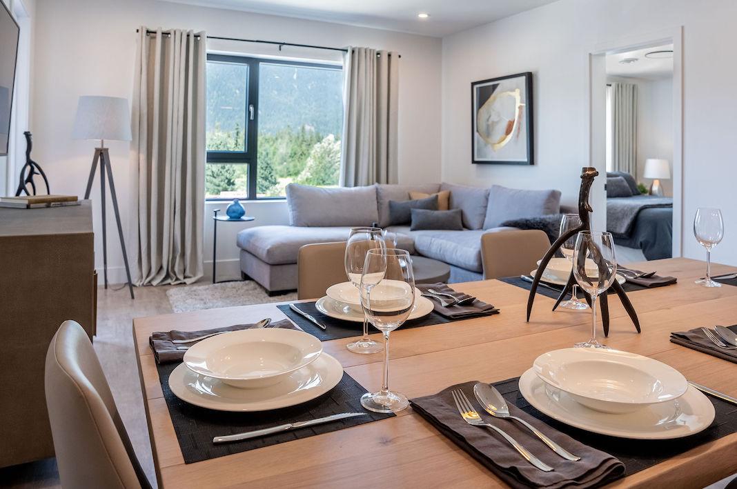 Open concept living dining kitchen in luxurious Revelstoke condo